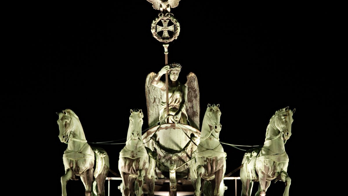 This picture is a close-up of the quadriga on top of the Brandenburg Gate in Berlin (Germany) at night. The sculpture was produced by Johann Gottfried Schadow in 1793. Be on the lo