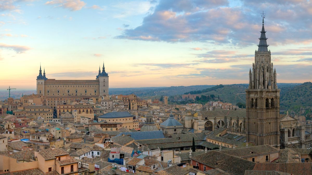 A 4 x 1 segment panorama of the Toledo Skyline in Spain at sunrise. Taken by myself in portrait format with a Canon 5D and 70-200mm f/2.8L lens. On the left Alcázar of Toledo and o